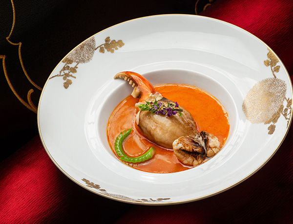 A Whole Fresh Crab Claw served with steamed Lobster Broth Egg White